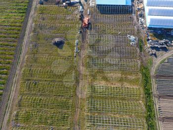 Frameworks of greenhouses, top view. Construction of greenhouses in the field. Agriculture, agrotechnics of closed ground.