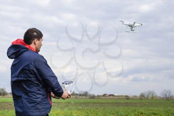 A man with a remote control in his hands. Flight control of the drone. Phantom.