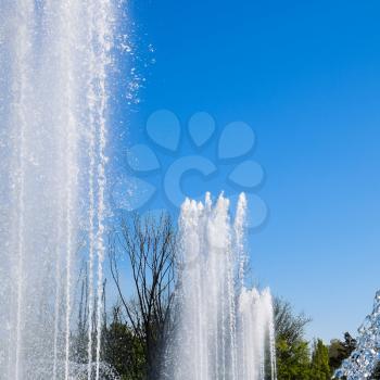 Krasnodar, Russia - May 1, 2017: City fountain in the city of Krasnodar. People are walking by the fountain. Water splashes.