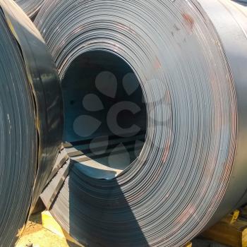 Steel sheets rolled up into rolls. Export Steel. Packing of steel for transportation.