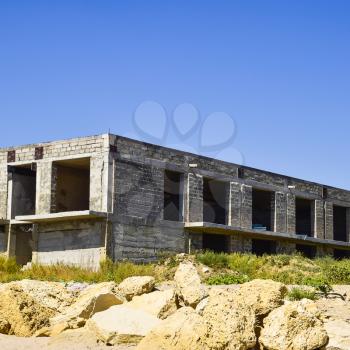 Unfinished building of gray block. Home construction.