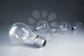 Group of lamp bulbs on studio background. 3D illustration
