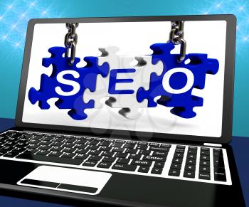 SEO Puzzle On Laptop Shows Online Searching And Website Optimizer