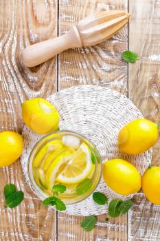 summer citrus lemonade drink with fresh lemon and mint