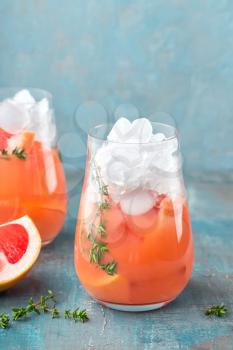 Grapefruit and thyme gin cocktail, refreshing drink with ice