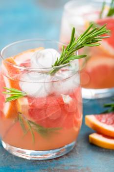 Grapefruit and rosemary gin cocktail, refreshing drink with ice