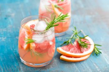 Grapefruit and rosemary gin cocktail, refreshing drink with ice