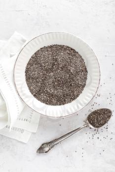 Chia seeds on white baclground directly above copy space