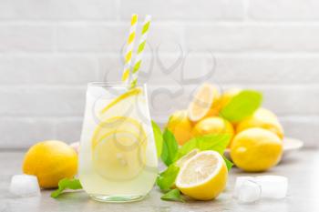 lemonade; lemon; drink; glass; juice; summer; fresh; background; fruit; cocktail; citrus; ice; water; cold; beverage; food; healthy; yellow; frozen; natural; white; sweet; refreshment; refreshing; str