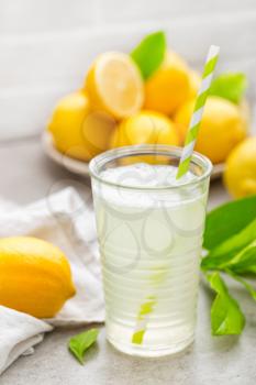 lemonade; lemon; drink; glass; juice; summer; fresh; background; fruit; cocktail; citrus; ice; water; cold; beverage; food; healthy; yellow; slice; natural; white; sweet; refreshment; refreshing; stra