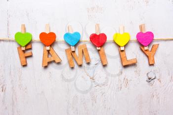the word family of the wooden letters on a white background