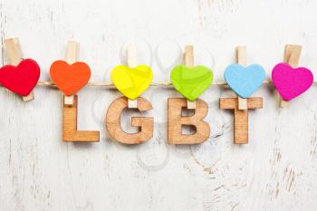  LGBT rainbow and hearts on a white wooden background.LGBT symbol