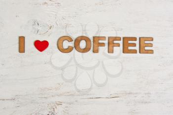 I love coffee from a wooden letters on a white background old wooden
