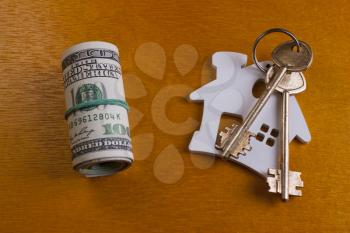 house key and dollars.Real estate concept