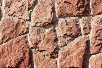 Textured wall background of red stone