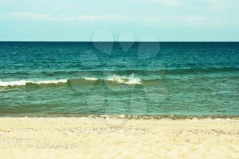 Beautiful sandy beach and the sea, blue sky,toning effect