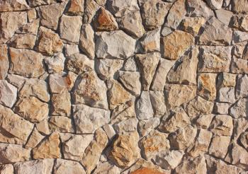 Background of brown, red stones in a chaotic manner, style of antique, medieval, concrete texture