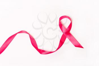 Pink ribbon on white background. International symbol of the fight against breast cancer, oncology