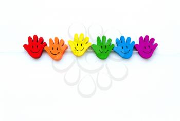 smiling palm of rainbow colors, a symbol of LGBT  on white background