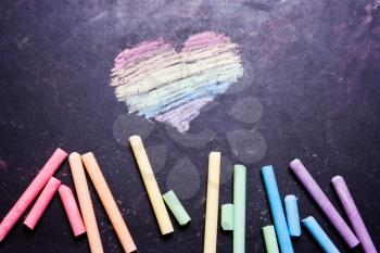 Heart painted with rainbow-colored chalk 