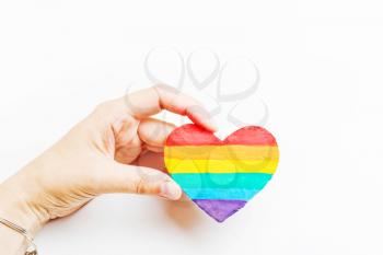 LGBT symbol in hand. Heart of the rainbow color on a white background