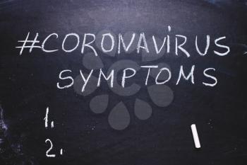  Coronavirus hashtag on chalk board. Epidemic concept