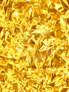 Gold foil vector background with shiny glare.