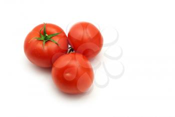 Three isolated tomatoes. Element of design.