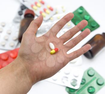 Hand with pills. Element of medical design.
