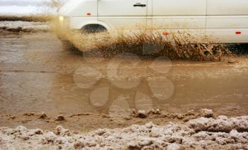 Car splash the puddle. Dynamic scene.
