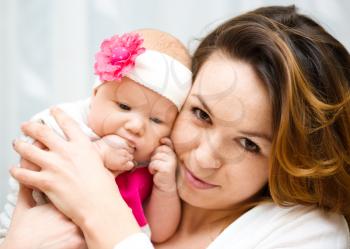 Mother holds cute 3 months baby