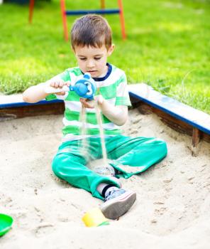 Cute little boy is playing on playground