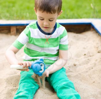 Cute little boy is playing on playground