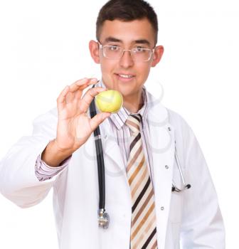 Portrait of medical male doctor with apple, isolated over white