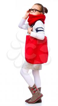 Cute girl with shopping bags, isolated over white