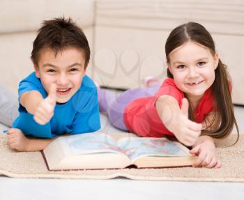 Happy children is reading book