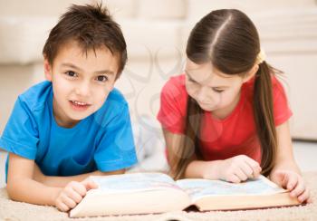 Happy children is reading book