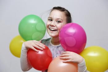 Cute beautiful girl celebrate her birthday. happy girl with balls