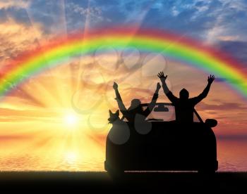 Travel and freedom. Happy people in the car with the dog on the sea sunset and rainbow