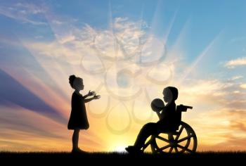 Child in wheelchair playing with healthy girl with ball on sunset. Concept of children with disabilities