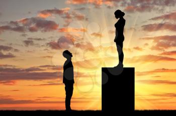 Feminists silhouettes standing on a pedestal looking down at the man. Feminism concept