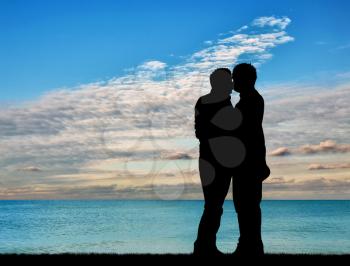 Concept of gay people. Silhouette happy gay kiss on a background seascape