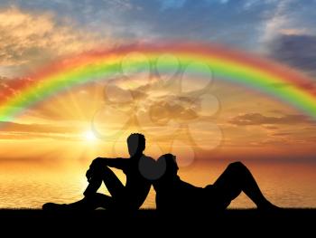 Homosexuals. Gay Couple lying relaxing at sunset by the sea with rainbow
