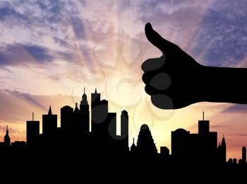 Concept of business. Silhouette hand gesture like against the evening city