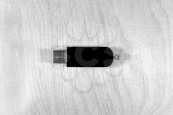 Flash card usb black color  on a wooden surface