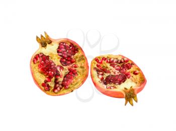 Halves of juicy pomegranate isolated on white background
