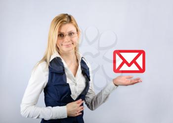 Concept of an email message. Business woman holding a email message icon