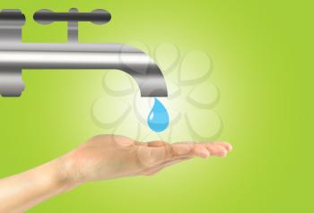 Concept of tap water. A drop of water falls into the hand of man from the tap