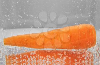 Juicy carrots in water. design element