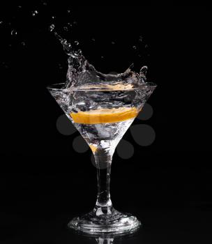 Vermouth cocktail inside martini glass over dark background